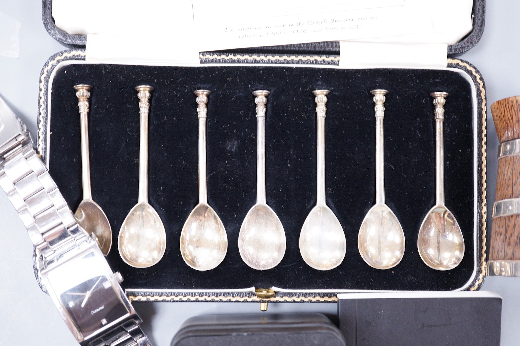 A cased set of eight George VI silver 'The Salisbury Seal Top' coffee spoons, J. Sidney Rumbridge, Sheffield, 1938, a late Victorian silver mounted wooden pepper mill and two gentleman's modern wrist watches.